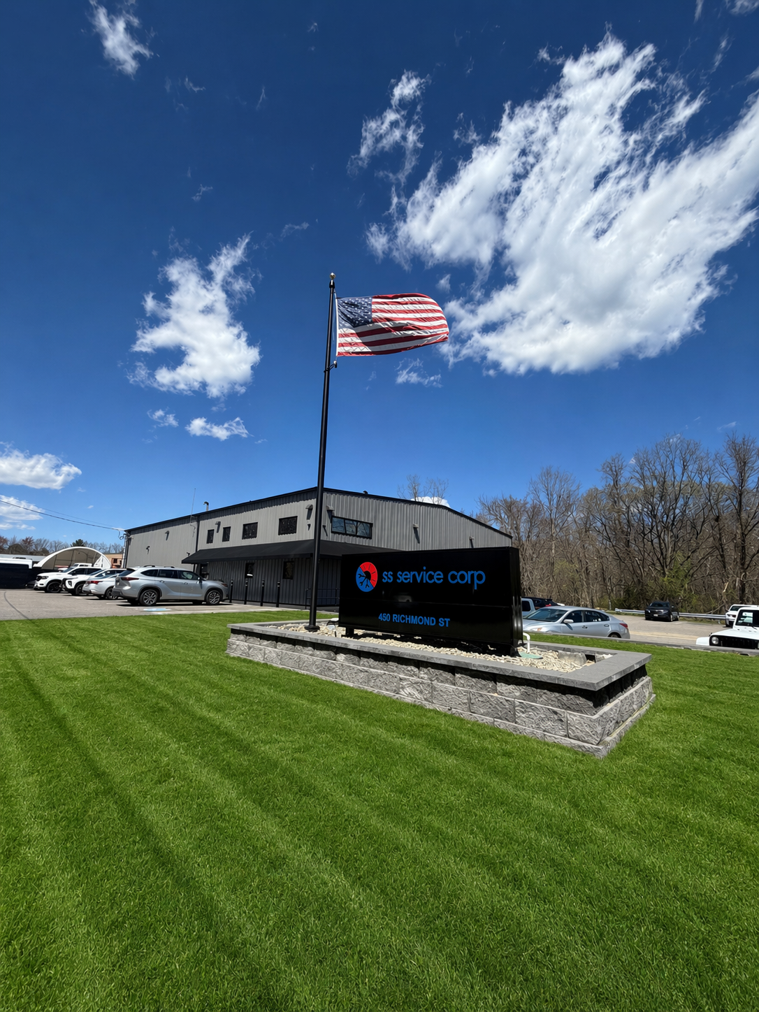 SS Service Corp sign and American flag outside the company facility